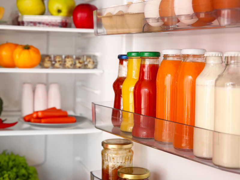 fruits, vegetables, juice and gazpacho in a clean fridge
