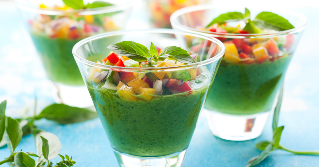 green gazpacho cups with variety of toppings on top